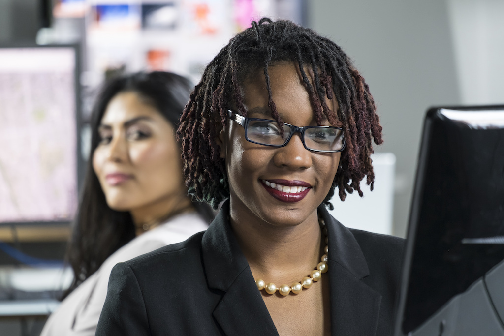 Young black female working at her computer in an office Young black female working at her computer in an office